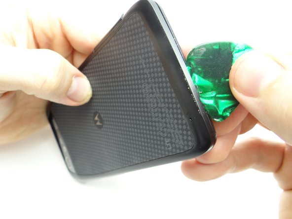 Work your way across the bottom, then up the opposite side to continue releasing clips.