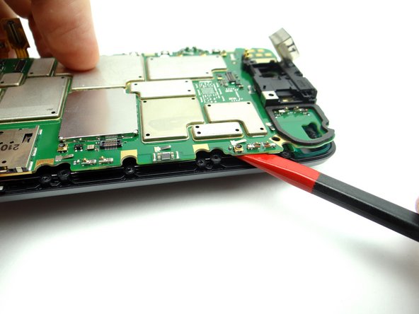 Picture 1: Insert the spudger near the top of the right side as shown.