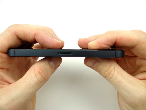 Picture 3: Replace two 3.6 mm Pentalobe screws near charging port from SLOT 1.