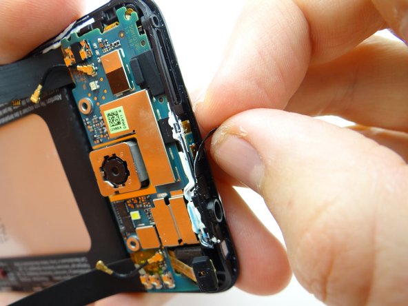 Replace tape from the back wall of COMPARTMENT B to hold the power button contact in place.