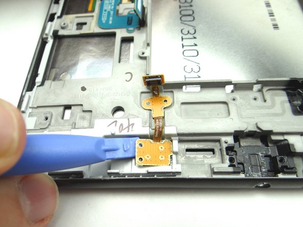 Use the blue pry tool to finish lifting the contact pad..