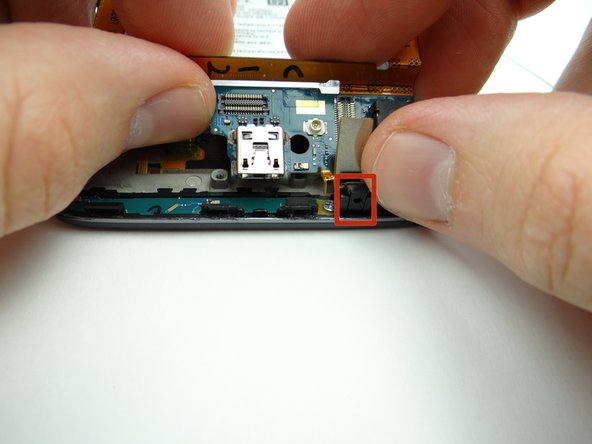 Push the microphone into its socket first.