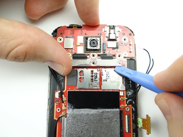 Lift the left and right sides of the silver connector bar.