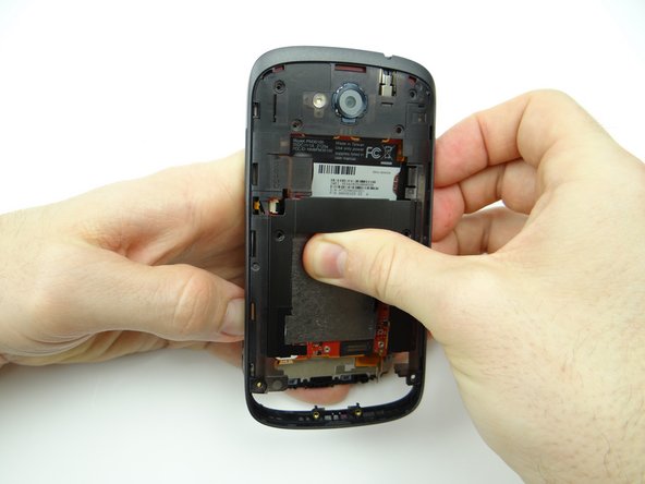 Picture 2: Turn the phone over, then finish removing the mid-body.