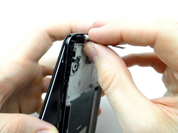 Note how the display cables feed through at the top and bottom.  This way you'll better understand how to feed them back through using the replacement display.