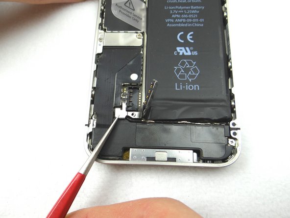 Picture 2: With Fine Point Tweezers, place the T-Shaped Antenna Shield from SLOT 2 between the battery connector and its socket.