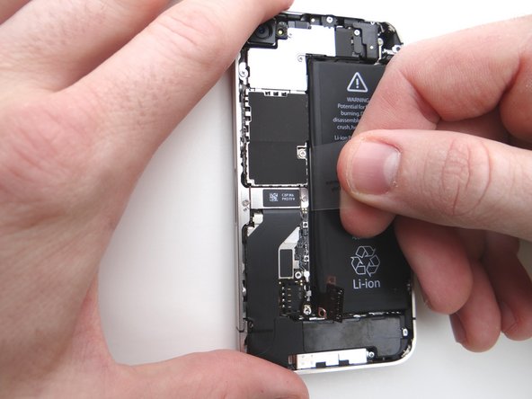 Once loose, use the plastic pull tab to peel the battery free from the iPhone.  Place the battery in ZONE II.