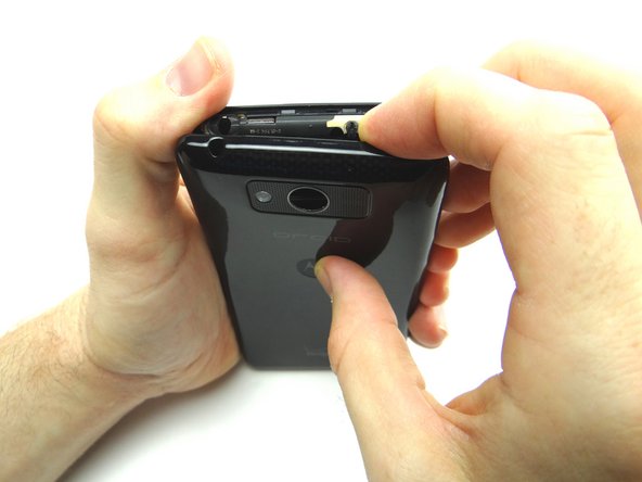 Continue working your way around the phone peeling off the battery cover.  Apply heat in 30 second increments if the battery cover won't budge.