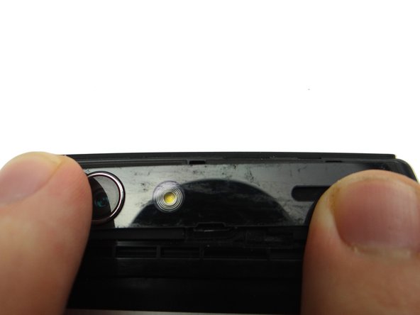 If the trim is loose, try heating the area to reactivate the adhesive.  Apply pressure until the trim is secure.  (If necessary, apply thin strips of double-sided adhesive to secure the trim.)