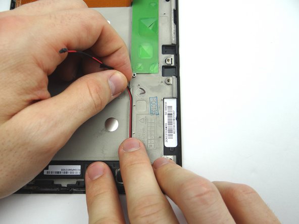 Peel up speaker cable.