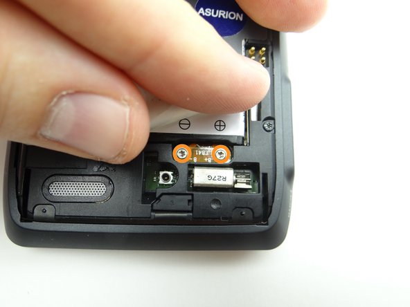 Picture 1: Remove two 3.3 mm T5 Torx screws with washers.  Place screws in SLOT 1 (with the cover).  Make sure the washers stay with the screws.