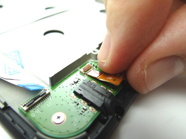 Push power and volume buttons cable head into open ZIF connector.