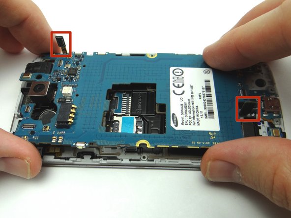 Guide charging port and headphone jack cables above the logic board.