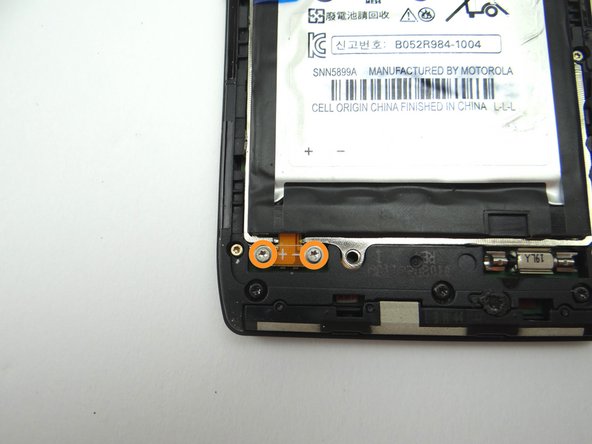 Picture 2: Remove two 3.3 mm T5 Torx screws and place into SLOT 2.