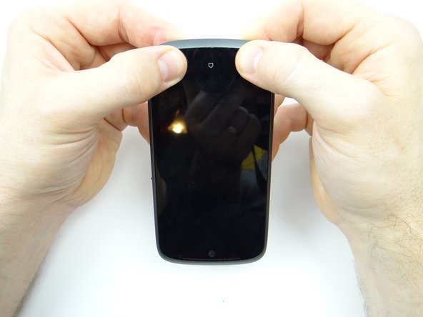 Work your way from bottom to top, snapping the front panel into place on the mid-body.  Snap the top edge (soft keys) into place.