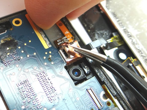 Picture 1: Use Curved Tip Tweezers to remove the copper tape wrapped around the digitizer's ribbon connector.