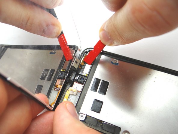 Picture 3: Open the display assembly to a 90 degree angle.  Disconnect the LCD ribbon cable with the spudger.
