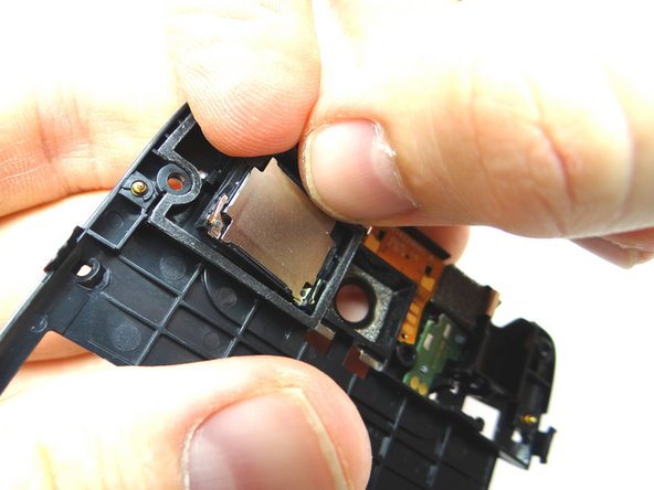 Picture 2: Finish peeling up loudspeaker with your fingers.