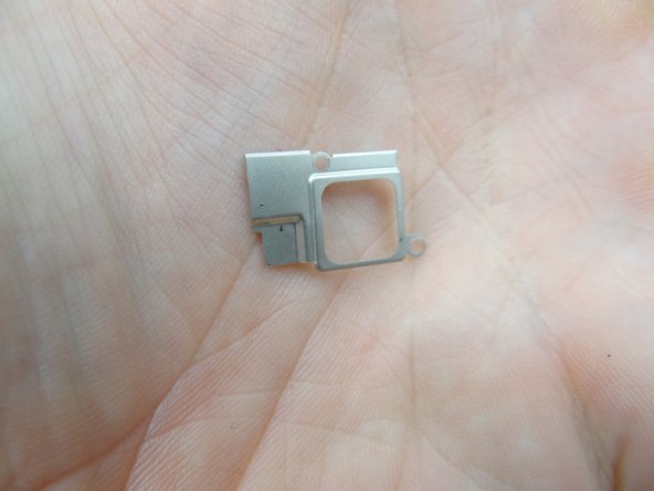 Picture 3: Remove the earpiece speaker.  Place with bracket in COMPARTMENT C.