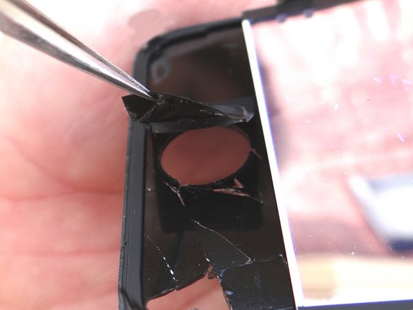 Picture 1: Use straight-tip tweezers to pull up the edge of the home button just enough to grab it with your fingers.