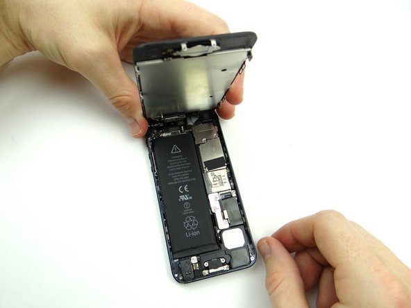 Pinch the front panel with your thumbs, then: