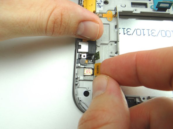 Lift front-facing camera slightly, then peel away from its socket.