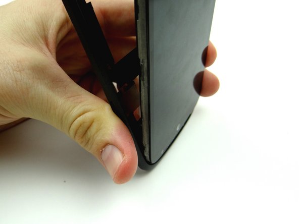 Slide the bottom edge (AT&amp;T logo) of the front panel into the mid-body.