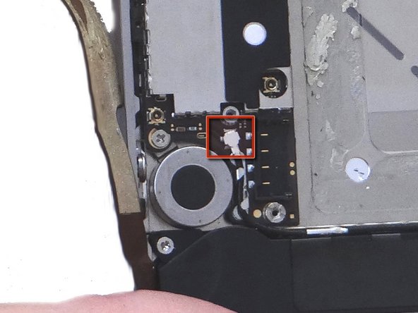 Push the cellular antenna back into its slot on the logic board as in Picture 2.