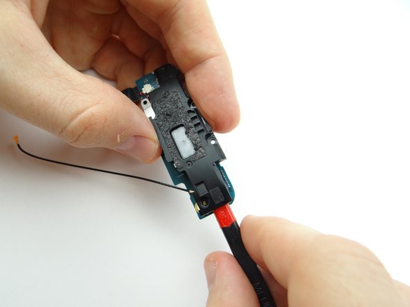 Picture 2: Wedge flat end of spudger as pictured.