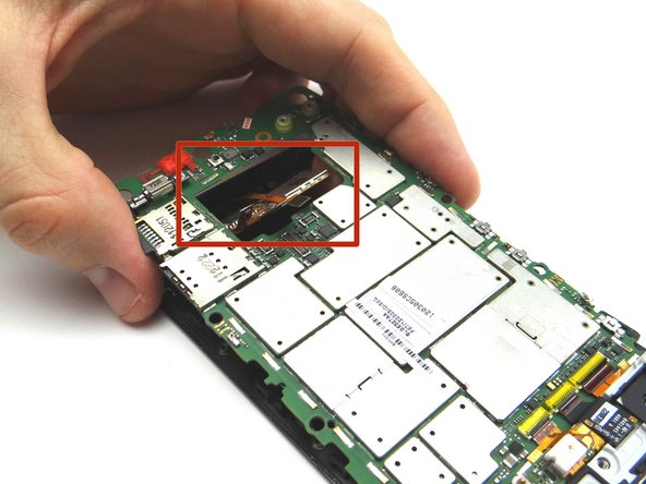 Picture 3: Feed the three display assembly cables through the opening at the bottom of the logic board.