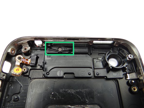 From COMPARTMENT F: seat the hinge,  then secure it with the screw in the same compartment.