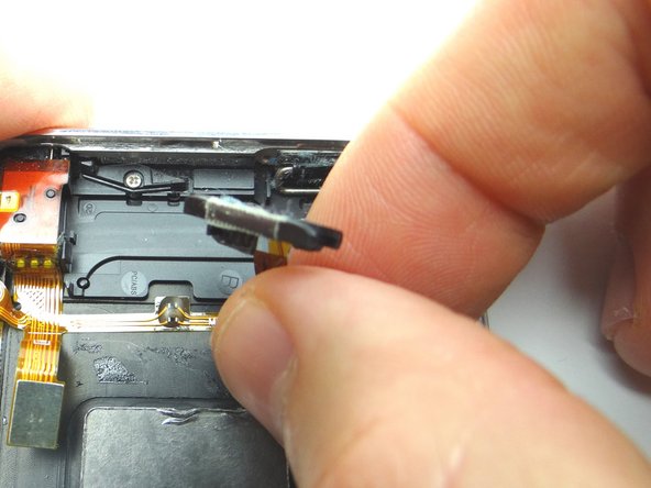 Picture 2: Peel power button cable away just enough to access the power button.