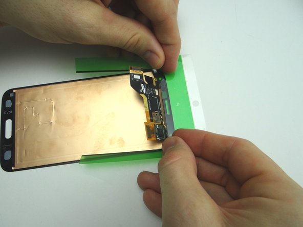 Picture 2: Peel off inner backing labelled '1' from the top half of the adhesive.  Position the top half of the adhesive starting at the top edge of the screen.  Make sure the adhesive strips aren't hanging over the edges.