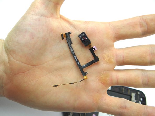 Place earpiece speaker/volume button assembly into COMPARTMENT E.