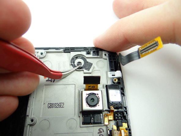 Make sure the adhesive strip remains aligned on the mid-frame.