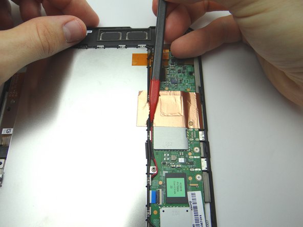 With the pointed end of the spudger, cut through the copper tape covering cables.