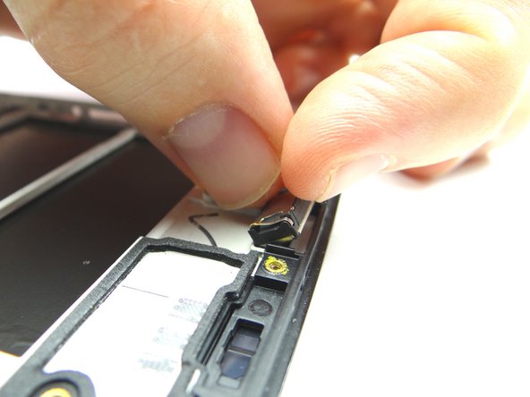 Picture 3: Once loose, remove the speaker with your fingers.  Place in COMPARTMENT D.