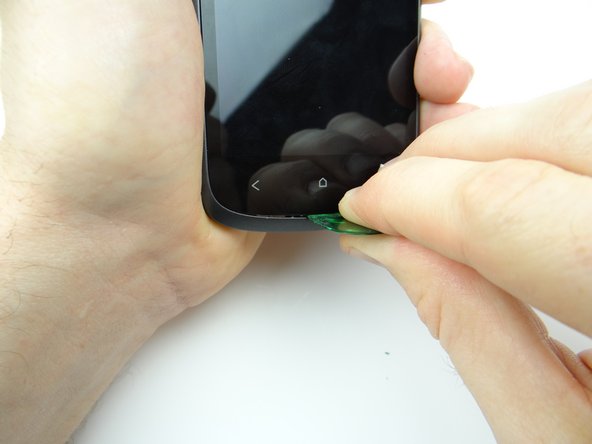 Picture 1: Use a guitar pick to wedge directly under the home soft key.