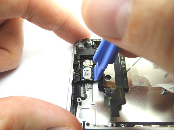 Picture 1: Wedge the Blue Pry Tool beneath the speaker (held by adhesive). Gently pry upwards. Place into COMPARTMENT C.