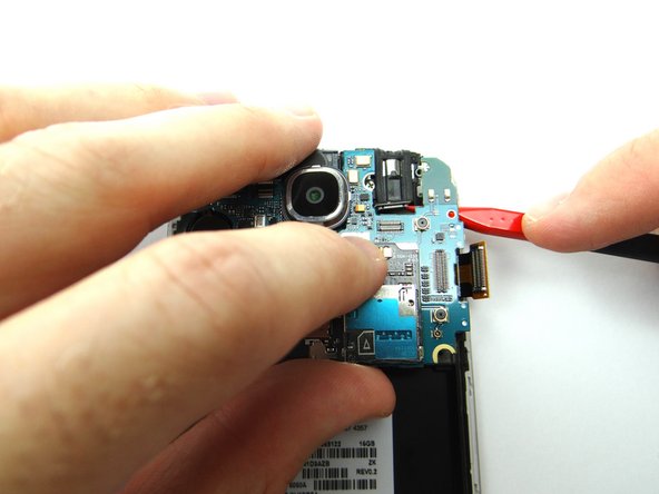 Picture 2: You may have to use the Black Spudger to feed the headset jack cable through to the top of the logic board.