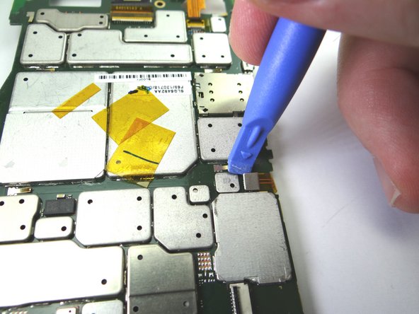 Use blue pry tool to disconnect antenna cable.