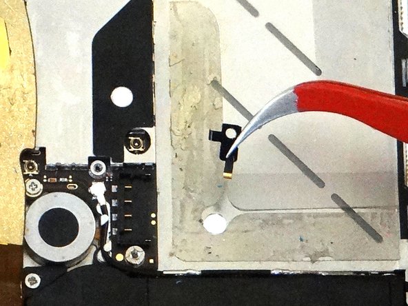 Picture 2: Use your fingers or Curved Tip Tweezers to remove the shield. Place the shield with the screw in SLOT 9.