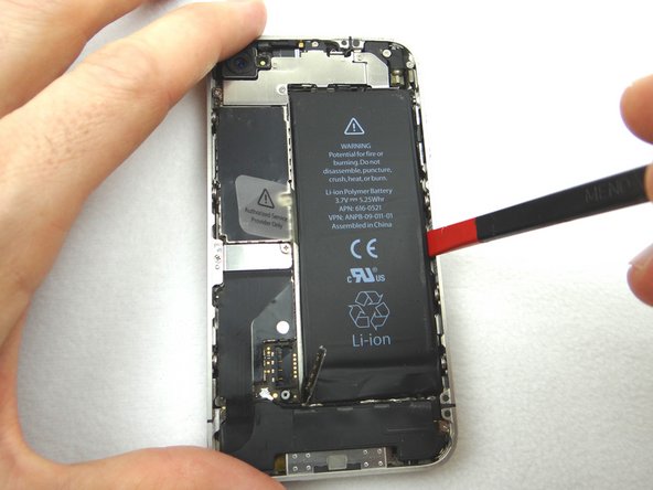 Wedge the flat end of the Black Spudger on the right edge of the battery. Gently pry up in three or four spots along the right edge to release the adhesive adhering it to the mid-frame.
