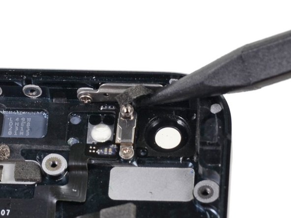 Use Black Spudger to remove foam rubber bumper covering the power button door. Place into COMPARTMENT C.