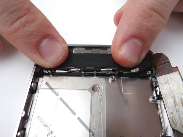 Replace the small triangular plastic bracket that was installed under the left-most screw from SLOT 12.