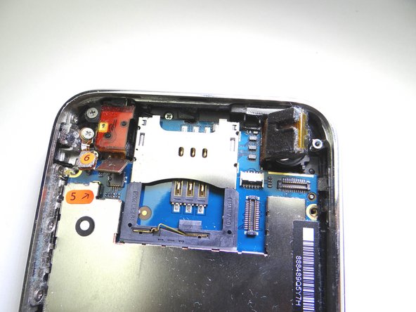 DO NOT TRY TO REMOVE THE CAMERA.  It's still attached to the underside of the logic board.