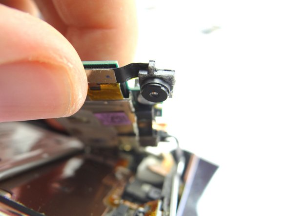 From COMPARTMENT C, connect the rear camera to the logic board.