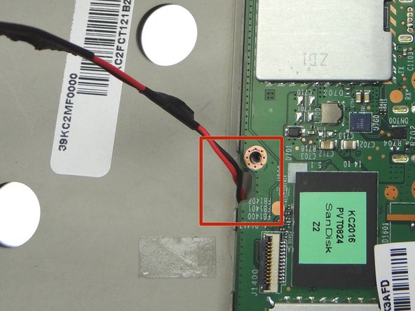 Picture 3: Make sure the lower speaker cable is feed through the opening in the logic board as pictured.