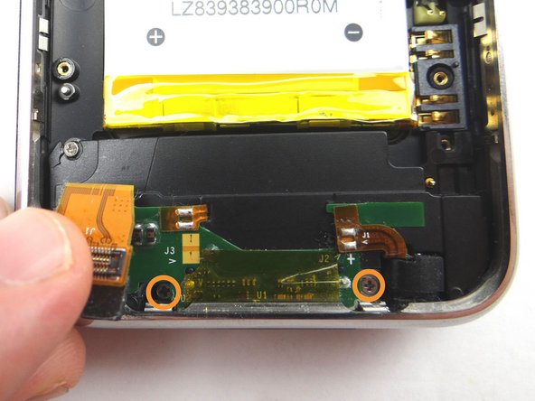 Remove two 1.5 mm Phillips screws.  Place in SLOT 8.