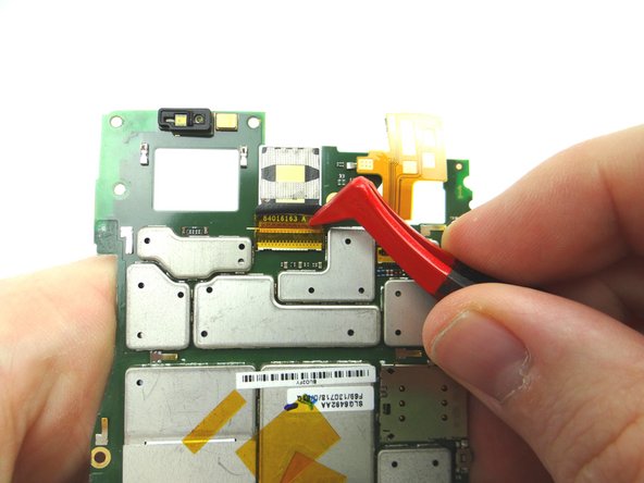 Picture 1: Use plastic tweezers to remove yellow Kapton tape.